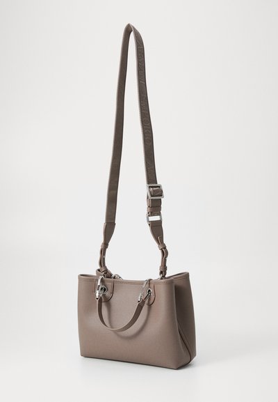 Brown textured handbag featuring dual handles, an adjustable strap, and metallic hardware details for secure closure and style.