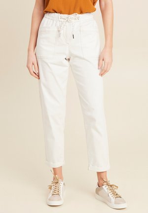 White, lightweight trousers with elastic waistband and drawstring. Features two front pockets and a relaxed fit with rolled hems.