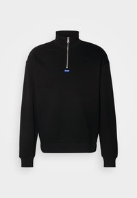 Black pullover sweatshirt made of soft material, featuring a high collar and half zip. Displays a blue rectangular logo at the chest.