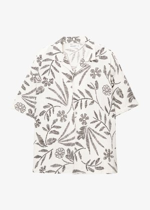 Rövid ujjú, galléros ing fehér anyagból, fekete virágos és levélmintázattal, kis gombokkal és laza fazonnal.