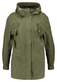 Olive green parka jacket with a hood, featuring two chest pockets, a zip closure, and adjustable drawstrings. Made from a textured fabric.