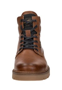Brown leather boot featuring black laces, round toe, and a textured rubber sole. Includes a padded collar and subtle branding.