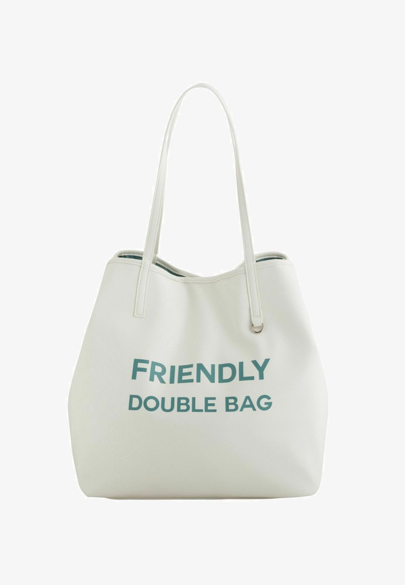 Sac fourre-tout blanc en matériau texturé avec l'inscription "FRIENDLY DOUBLE BAG" en lettres teal audacieuses. Deux anses pour le porter.