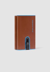 Brown leather wallet with blue accents, featuring a front cutout, and a black hardware button for functionality. Compact and rectangular design.