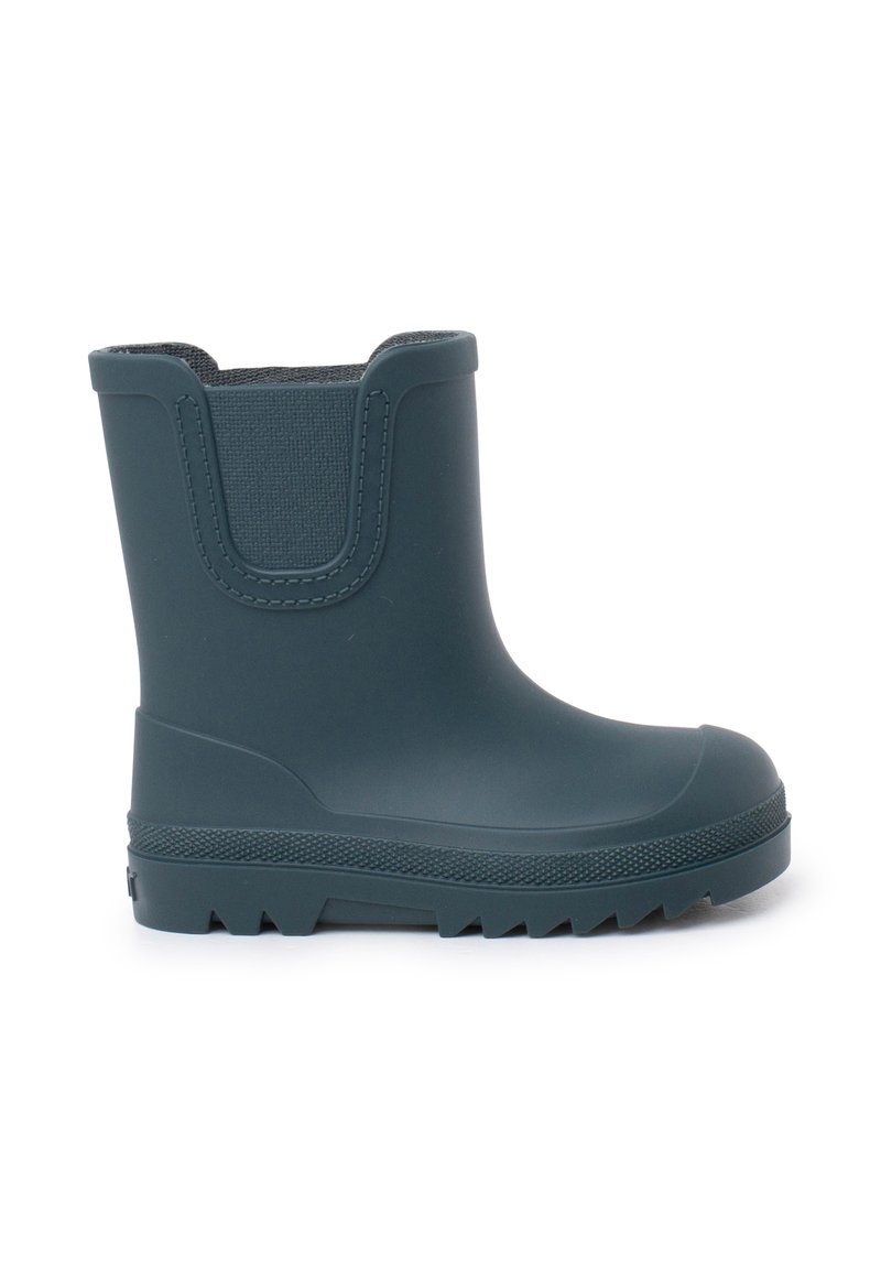 Botte en caoutchouc bleu foncé avec insert élastique texturé, semelle épaisse, bout rond et détails striés sur la semelle pour une adhérence optimale.