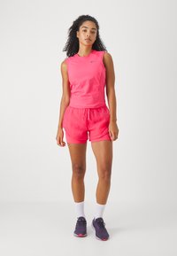 Nike Performance Sportiniai šortai - aster pink