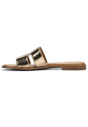 Metallic gold slide sandal with two open straps, flat tan sole, and smooth texture. Features minimalistic design and elegant finish.