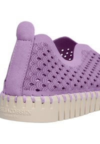 Purple rubber shoe featuring textured scalloped patterns, a padded heel tab, and a beige segmented sole with threaded accents.