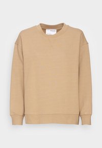 Felpa beige a girocollo con maniche lunghe, polsini e orlo a coste, con piccolo dettaglio cucito sotto il colletto e un'etichetta interna bianca.