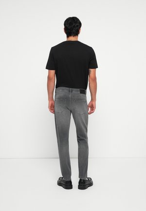 Vaqueros tapered - dark grey