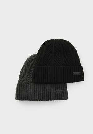 Two knitted beanies: one black with a ribbed texture and fold-over cuff, the other dark gray with a herringbone pattern and ribbed band.
