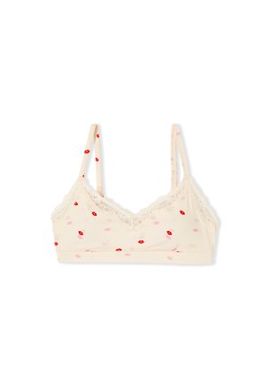 Heller Bralette in Cremefarbe mit dünnen verstellbaren Trägern, Spitzenbesatz und Muster aus roten und pinken Lippenabdrücken auf dem Stoff.