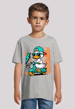 Gray t-shirt featuring a cartoon duck on a teal scooter, wearing sunglasses and a cap. Background includes orange and checkered patterns.