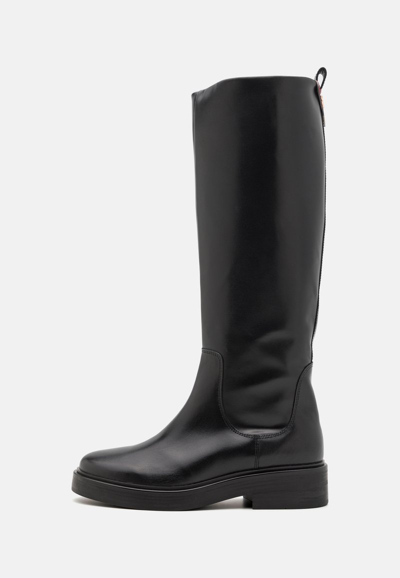 Black knee-high boot with a smooth, glossy finish. Features a rounded toe, chunky heel, and subtle seam detailing.