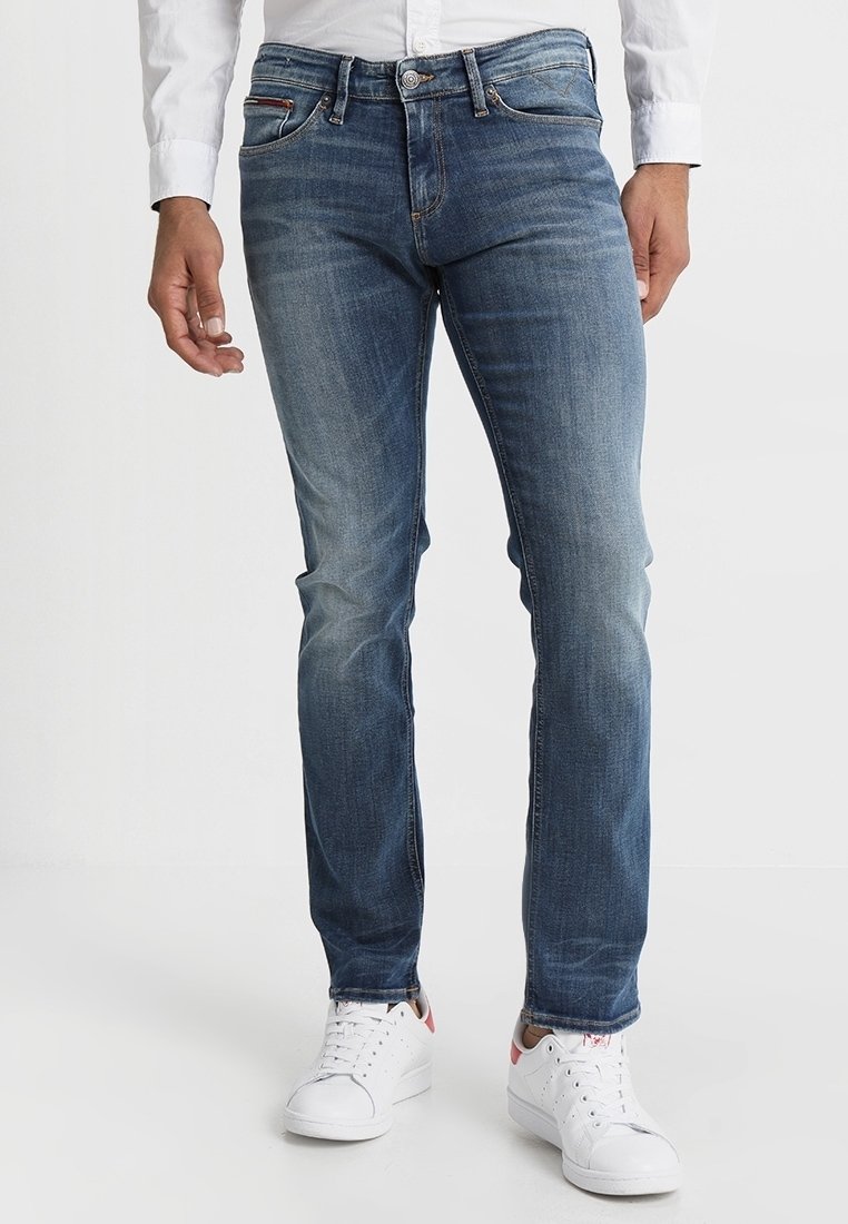 Slim-fit modré džíny s vybledlým vzhledem, s klasickým pětipocketovým designem a lehkým vyblednutím na přední straně.