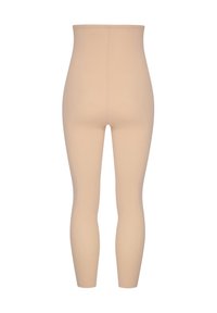 Leggings beige a vita alta con una texture liscia e una forma aderente, caratterizzati da un design senza cuciture e senza hardware visibile.