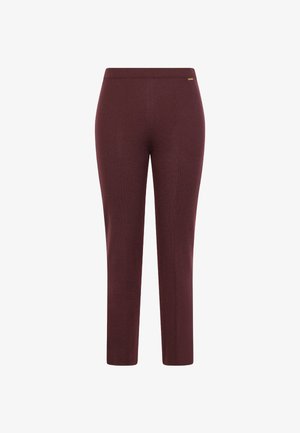 Burgundy stretch pants with a smooth texture, a fitted design, and a simple waistband; features a minimalistic logo detail.