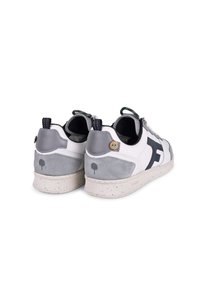 White and grey sneakers made of leather and suede with a textured heel, navy accents, and speckled soles. Features contrasting logo on side.