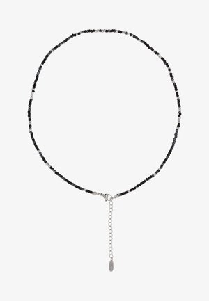 Delicato collier in perline nere e argento con chiusura in argento e catena estensibile regolabile.
