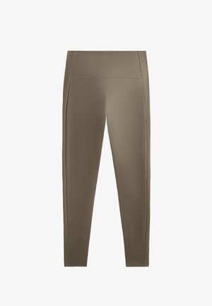 Hnědé sportovní legíny s vysokým pasem, vyrobené z hladkého materiálu, s jemnými detaily bočního panelování. Přiléhavý design po celém obvodu.