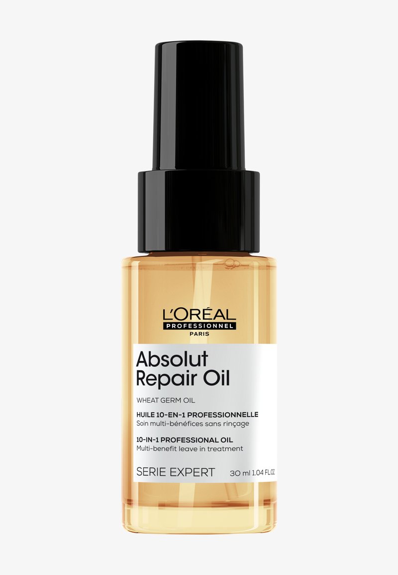 L'Oréal Absolut Repair Oil, 30 ml, bottiglia di vetro trasparente con tappo nero, liquido arancione, etichetta bianca e nera che indica un trattamento leave-in multi-funzionale.
