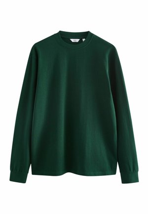 Langærmet T-shirt med rund hals i mørkegrøn. Lavet af glat bomuld med ribbede manchetter, har en enkel, afslappet pasform og ingen mønstre.