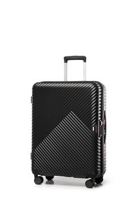 Black hard-shell suitcase with a textured, ribbed pattern, diagonal accents, four wheels, and a retractable handle. Closure with a zipper.