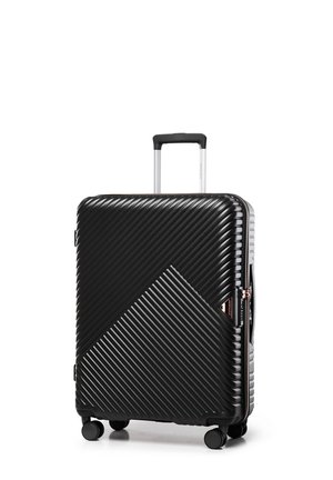 Black hardshell suitcase with diagonal ribbed texture, a telescopic handle, four wheels, and a zippered closure featuring a geometric design.