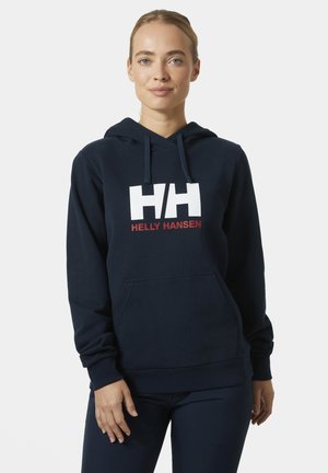 Granatowa bluza z kapturem, z przednią kieszenią typu kangur, oraz białym logo "HH" nad "HELLY HANSEN" w czerwonym kolorze. Miękka tkanina z długimi rękawami.