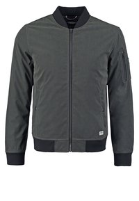 Giacca bomber grigia con zip frontale, polsini a coste, una tasca sulla manica sinistra e una texture liscia e opaca. Design semplice e funzionale.