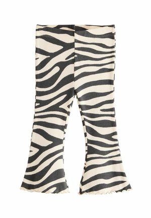 Leggings a zebrini neri e crema con stampa, a campana con texture a coste e orlo arricciato, caratterizzati da una silhouette aderente e una vita elastica.