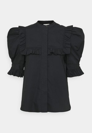Black cotton blouse featuring puffed sleeves, pleated accents, a button closure, and ruffled detailing along the shoulders and cuffs.