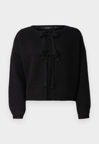 Suéter corto negro hecho de una tela suave y texturizada. Presenta un cuello redondo y un lazo frontal con dos cintas largas. Puños y dobladillo acanalados.