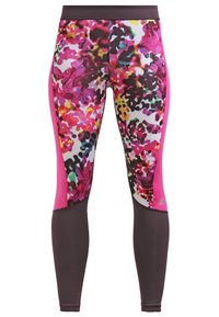 Leggings de talle alto con un vibrante patrón floral en rosa, morado y negro en la parte superior de las piernas y un tejido sólido de color marrón oscuro en la parte inferior.