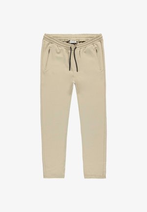 Beige joggingbroek met elastische tailleband en zwart trekkoord, voorzien van zijzakken met rits en taps toelopende pijpen.