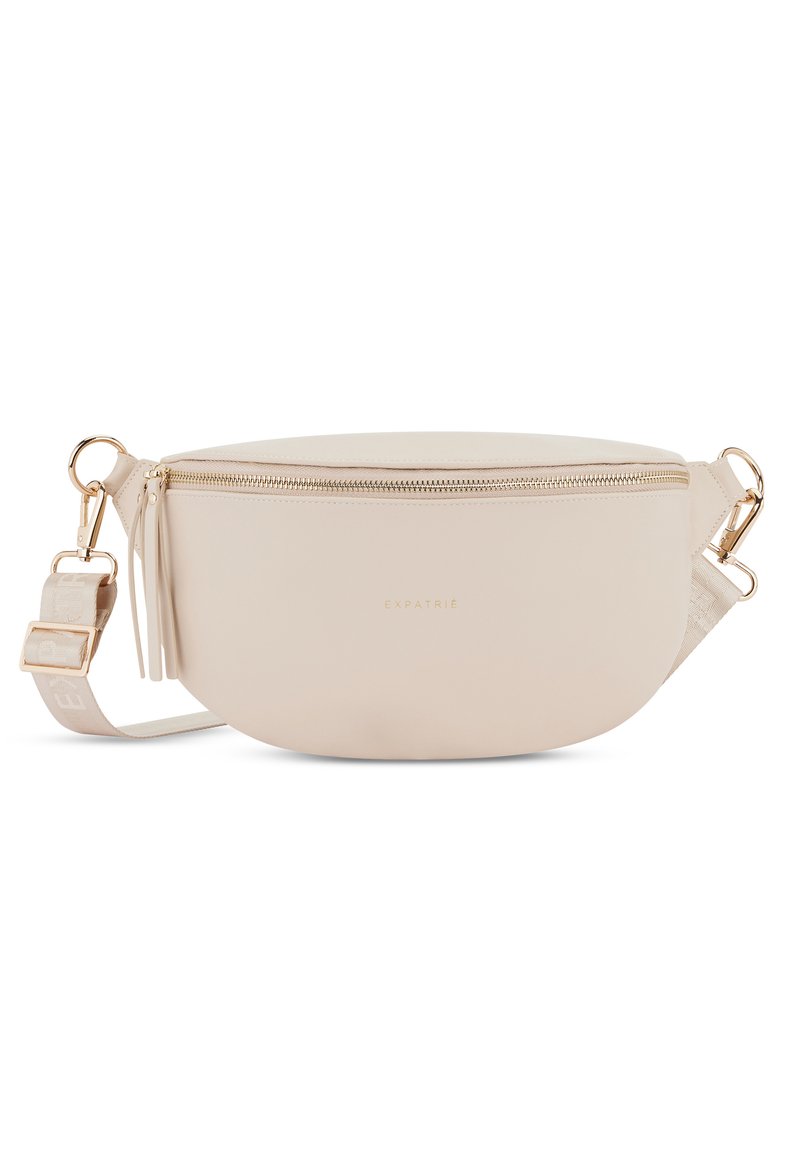 Svetlo béžová kožená crossbody taška so zlatými prvkami, so zipsom a textúrovaným popruhom s logom. Obsahuje detail s třásňami.