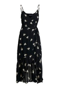 Vestido negro envolvente con estampado floral blanco, tirantes finos y un dobladillo asimétrico y fluido. Fabricado en un tejido ligero con una textura suave.