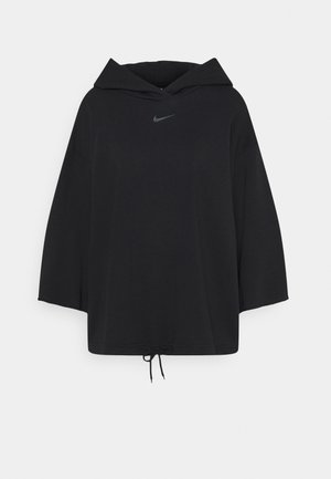 Sweat à capuche noir à manches longues avec une coupe ample, petit swoosh Nike sur la poitrine et cordon réglable à l'ourlet.