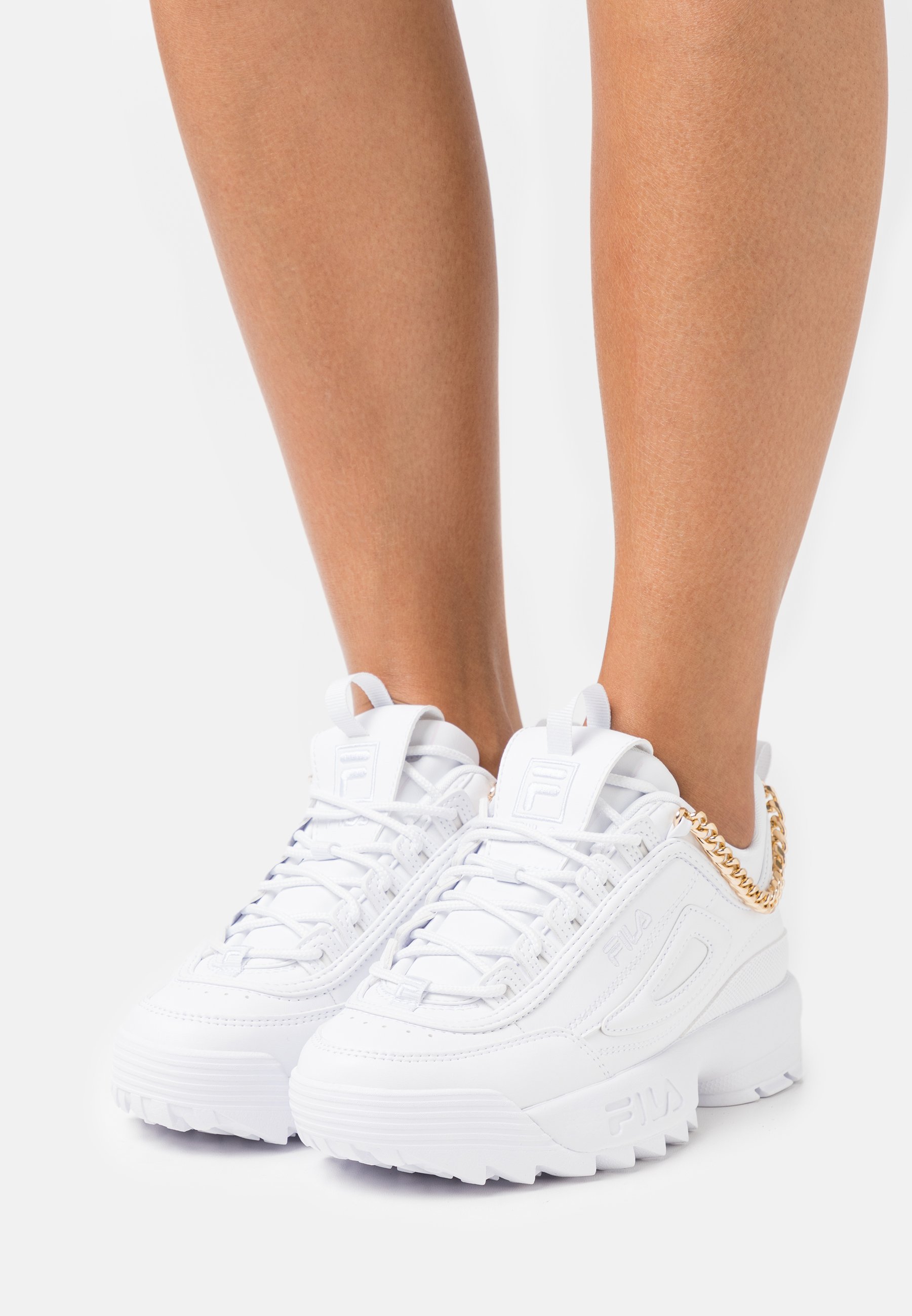 fila white and gold trainers