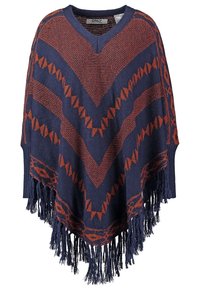 Poncho med marinblå och rostfärgade geometriska mönster, V-ringning och fransad nederkant.