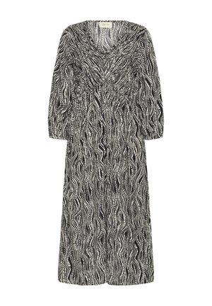 Vestido de longitud media en blanco y negro con un patrón de ondas, detalles fruncidos en la cintura y mangas de tres cuartos. Textura de tela suave.