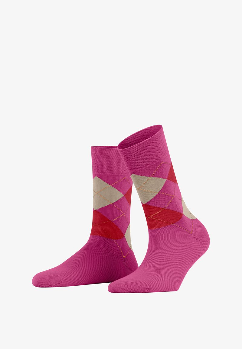 Pink socks with an argyle pattern in shades of red, beige, and orange. Made of soft material, with a crew length and ribbed cuff.