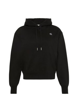 Svart hettegenser med kengurulomme og snøring i hetten. Har en diskret brodert hvit logo på brystet. Mykt stoff, avslappet passform.