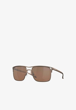 Brown-tinted sunglasses with a metal frame, square lenses, and adjustable nose pads. Slim arms feature subtle branding accents.