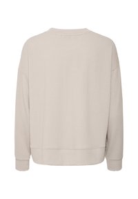 Pull côtelé beige à manches longues avec col rond et poignets ajustés, vu de dos sur fond blanc.