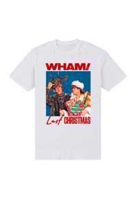 Bílé tričko s barevným motivem dvou osob v svátečním oblečení. Text v červené barvě zní „WHAM! Last Christmas“.