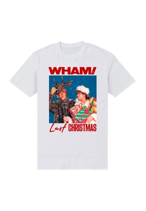 Camiseta blanca con un gráfico colorido de dos personas con ropa navideña. El texto dice "WHAM! Last Christmas" en rojo.