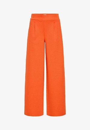 Oranžové široké nohavice vyrobené z mäkkej látky, s vysokým pásom a dvoma prednými záhybmi pre dodatočnú štruktúru.