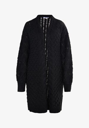 Mustvalge kudumiga kardigan avatud ees, millel on tekstuursed nöörmuster ja soonikvarrukad. Pikkade varrukatega ja kuni põlveni ulatuv disain.