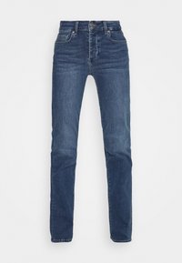 Tmavě modré džínové kalhoty s rovnýma nohama, vysokým pasem a pěti kapsami. Vyznačují se jemným opráním a zapínáním na kovový knoflík vpředu.